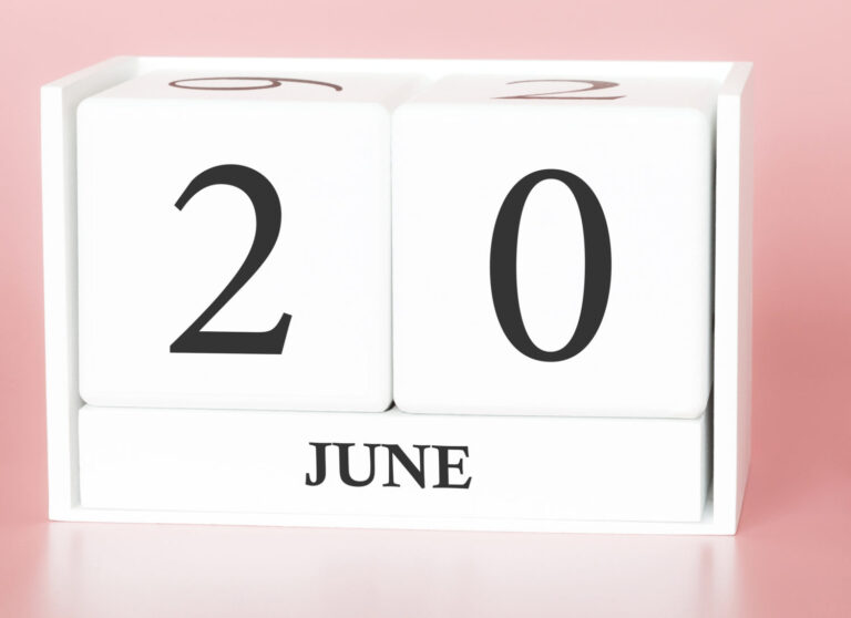 June 20th. Day 20 of month. Calendar cube on modern pink background with car