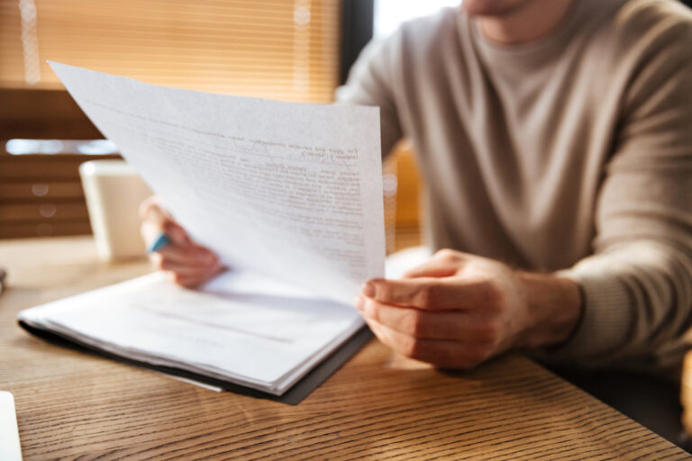 Cropped photo of attractive young man in office working