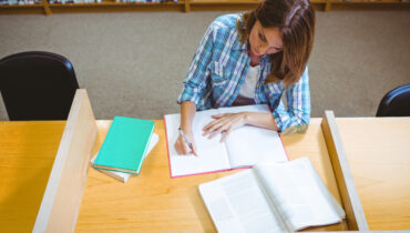 Mature student in the library at the university